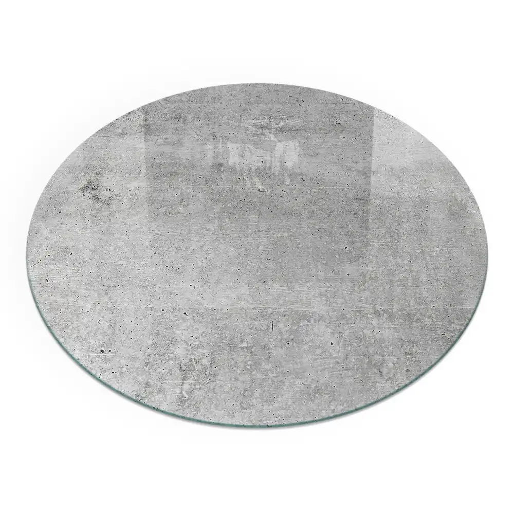 Okrągły panel kominkowy z surowego betonu w stylu minimalistycznym